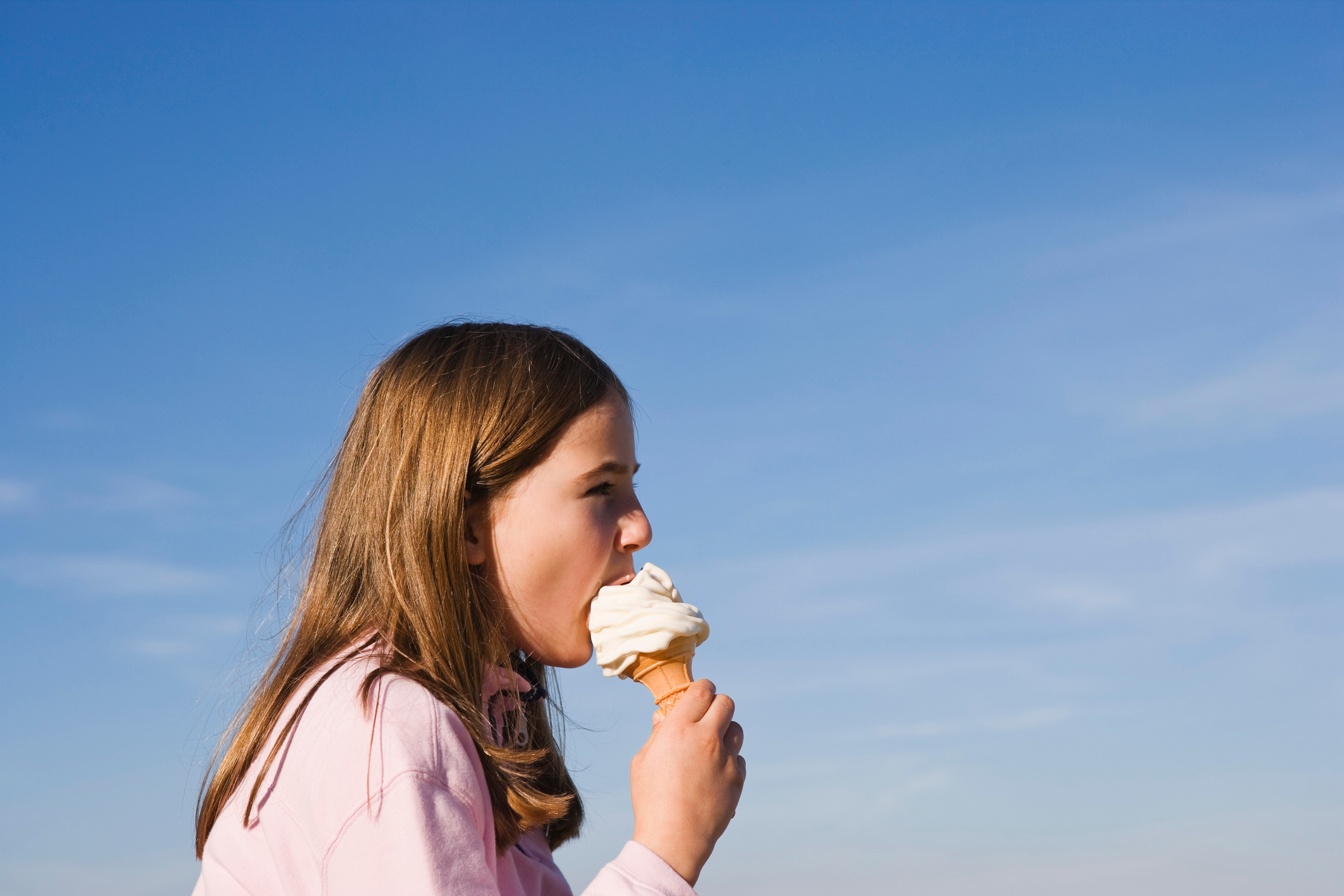 GettyImages-82154265 girl eating vanilla ice cream cone