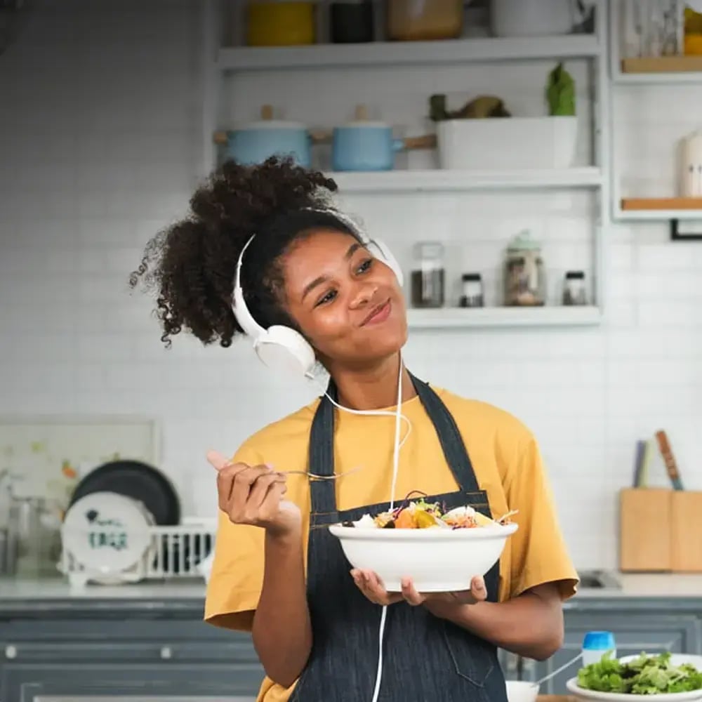Chef listening to podcast in kitchen